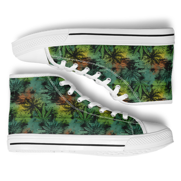 A pair of high top sneakers with a cannabis leaf pattern on the upper in green, white, and yellow colors.